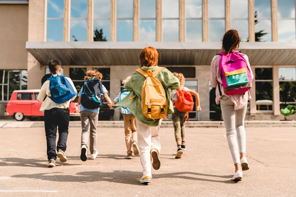 Little,Kids,Schoolchildren,Pupils,Students,Running,Hurrying,To,The,School